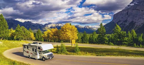Recreational Vehicle Driving on Autumn Highway In Beautiful Mountains Wilderness in Jasper, AB, Canada